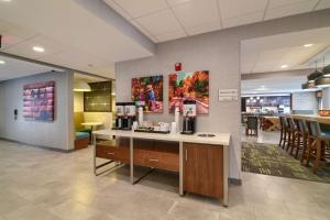 a lobby with a counter with a coffee maker on it at Hampton Inn Lincoln White Mountains in Lincoln