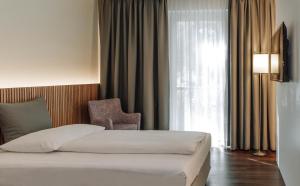 Postel nebo postele na pokoji v ubytování HEINhotel vienna airport