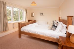 A bed or beds in a room at Spedding Fold Chapel Stile