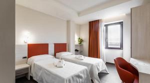 Postel nebo postele na pokoji v ubytování LUAL Bleisure Hotel + 25 fotografií