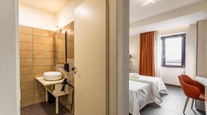 Postel nebo postele na pokoji v ubytování LUAL Bleisure Hotel