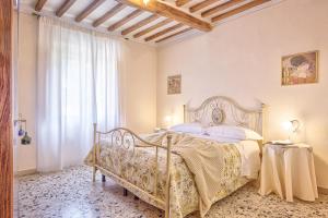 Posteľ alebo postele v izbe v ubytovaní Casa Bacco - Together in Tuscany + 5 fotografií