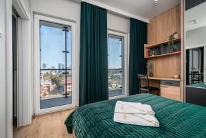 Postel nebo postele na pokoji v ubytování Warsview Apartments