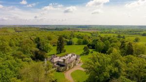 an aerial view of a large house in a field at Bell Tower Cottage in Middleton