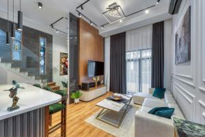 a living room with a couch and a table at PRO HOME SUİTES in Istanbul