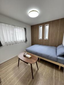 Postel nebo postele na pokoji v ubytování 椛時雨