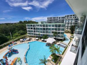 an overhead view of a large swimming pool in front of a hotel at La Vita Phuket Rawai in Rawai Beach