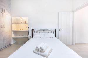 Postel nebo postele na pokoji v ubytování Joyfull Apartment In Piraeus + 13 fotografií