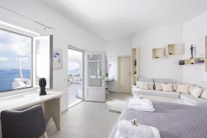 Postel nebo postele na pokoji v ubytování Ambition Suites + 37 fotografií