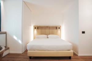 Postel nebo postele na pokoji v ubytování Aparthotel Colombo Roma