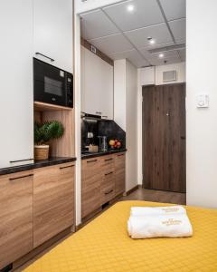 Kuchyň nebo kuchyňský kout v ubytování Warsview Apartments + 89 fotografií