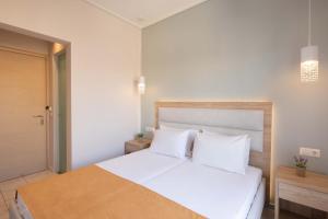 Voodi või voodid majutusasutuse Hotel Rossis toas