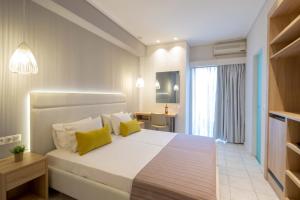 Voodi või voodid majutusasutuse Hotel Rossis toas