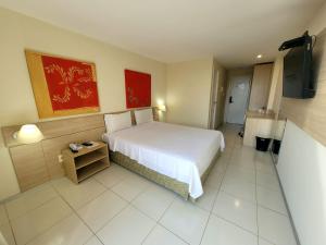 Letto o letti in una camera di Praiabella Hotel