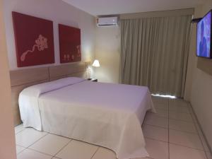 Letto o letti in una camera di Praiabella Hotel
