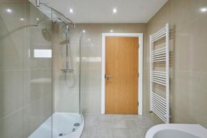 a bathroom with a shower and a toilet and a sink at Host & Stay - The Knight Street Penthouses in Liverpool