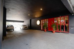 a parking lot with cars parked in a garage at Hotel Asrani International in Secunderabad