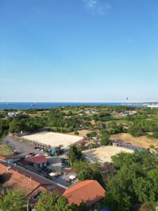 an aerial view of a parking lot near the ocean at MAVİ AT HOTEL Blue Horse in Gümüşdere