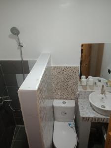 a bathroom with a toilet and a sink at BBoutique Hotel in Lapu Lapu City