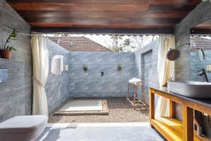 a bathroom with a sink and a toilet and a shower at Deshadan's Tarangi Beach Villas,Marari in Mararikulam +59 photos