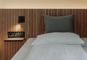 Postel nebo postele na pokoji v ubytování HEINhotel vienna airport