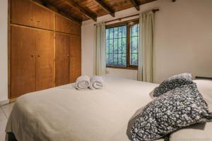เตียงในห้องที่ Casa Bellavista Ushuaia