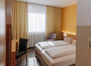 Postel nebo postele na pokoji v ubytování HEINhotel vienna airport