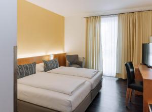 Postel nebo postele na pokoji v ubytování HEINhotel vienna airport