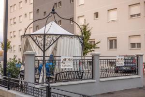 a gazebo on a balcony with a building at ForS Resort & Spa in Belgrade +155 photos
