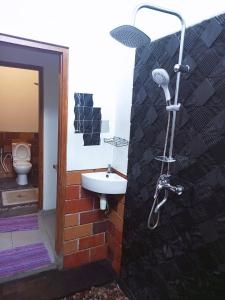 a bathroom with a sink and a toilet at ZEN MOON Hostel in Yogyakarta