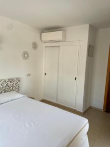 Postel nebo postele na pokoji v ubytování Hostal Roberto