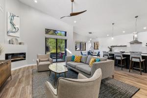a living room with a couch and a table at Modern Luxury Home in the Heart of West Sedona in Sedona