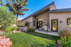 a home with a garden with a lawn at Modern Luxury Home in the Heart of West Sedona in Sedona