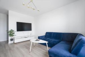Televízia a/alebo spoločenská miestnosť v ubytovaní Baltic Vista - sea view- Polsat Plus Arena