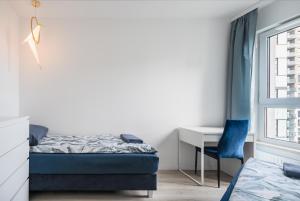 Кровать или кровати в номере Baltic Vista - sea view- Polsat Plus Arena