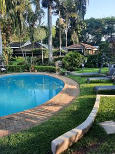 a swimming pool in the yard of a house at Leadwood Guesthouse in Tzaneen
