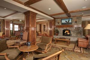 a living room filled with furniture and a fireplace at Lone Eagle Ski In Ski Out Condo in Dillon