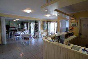 a kitchen and dining room with a table and chairs at Stella Hotel Apartments in Fiskardo