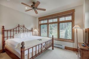 a bedroom with a bed and a ceiling fan at Lone Eagle Ski In Ski Out Condo in Dillon