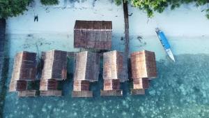 an aerial view of a group of bricks in the water at Firdas Bungalows in Waisai