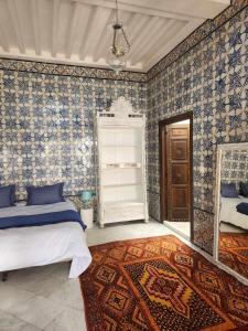 Postel nebo postele na pokoji v ubytování Maison typique de la médina