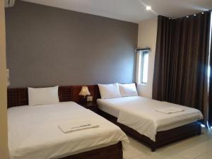 Postel nebo postele na pokoji v ubytování GOLD Hotel