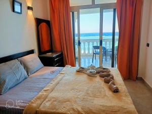 a bedroom with a bed with a view of the ocean at Lucky palace Dahab in Dahab