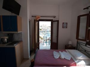 A bed or beds in a room at Calypso Hotel