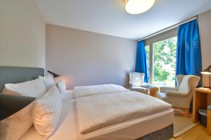 Un pat sau paturi într-o cameră la Vogelsburg