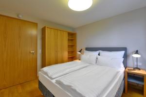 Säng eller sängar i ett rum på Vogelsburg