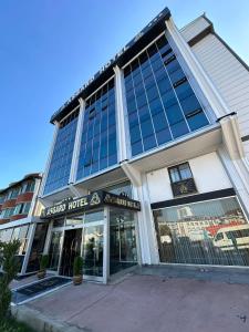 a large building with a lot of windows at Asgard Hotel in Beylikduzu