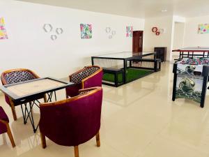 Posezení v ubytování Poppys Pleasant Stay
