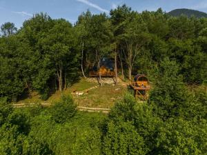 a tractor is parked on a hill in the woods at Diamond Cabin Orava in Párnica
