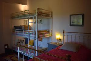 Uma cama ou camas num quarto em Casal Serrano Charme e Tranquilidade